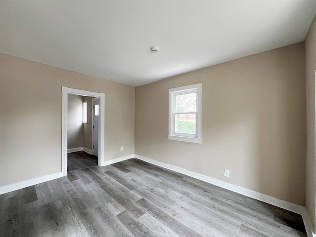 spare room featuring hardwood / wood-style flooring