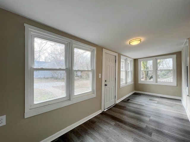 doorway featuring dark hardwood / wood-style floors