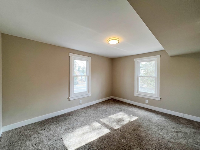 unfurnished room featuring carpet