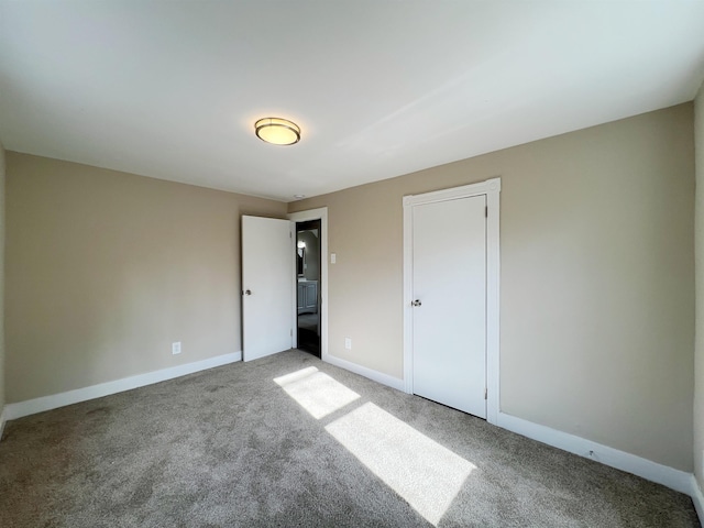 unfurnished bedroom featuring carpet