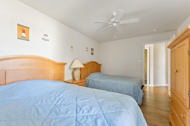 bedroom featuring ceiling fan and hardwood / wood-style floors