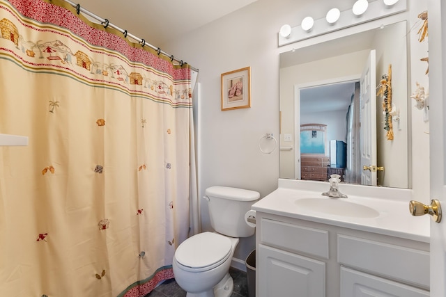 bathroom featuring toilet and vanity