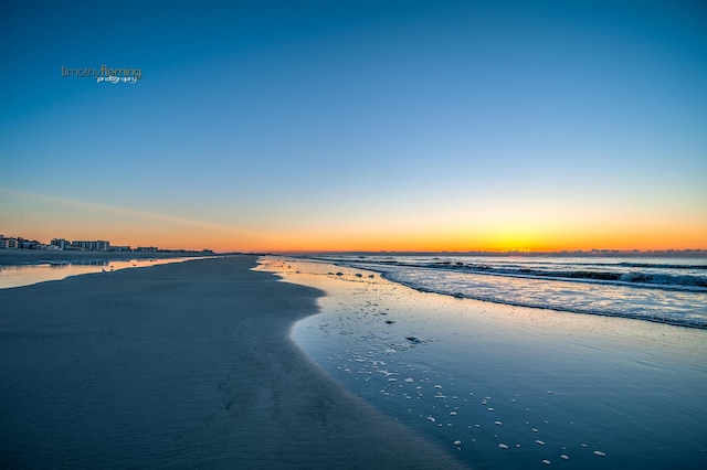 property view of water featuring a beach view