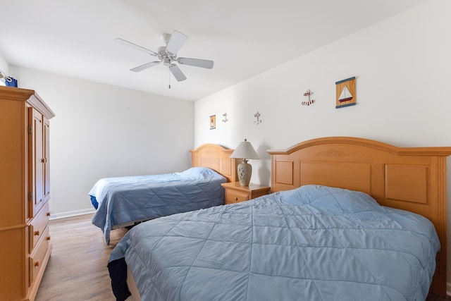 bedroom featuring ceiling fan and light hardwood / wood-style floors