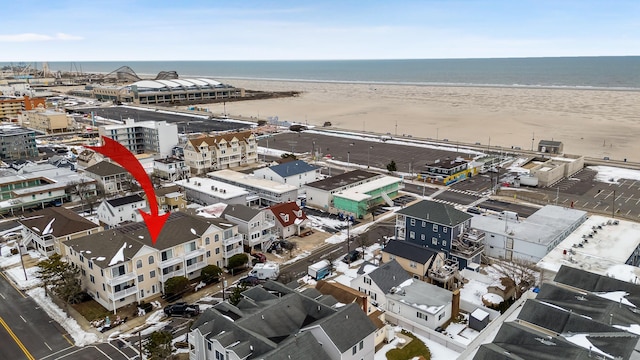 bird's eye view with a view of the beach and a water view