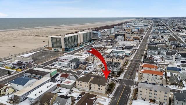 aerial view featuring a water view and a beach view