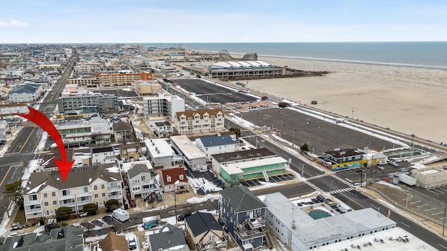 birds eye view of property featuring a water view and a view of the beach