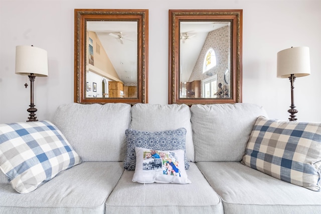 living room with ceiling fan and vaulted ceiling