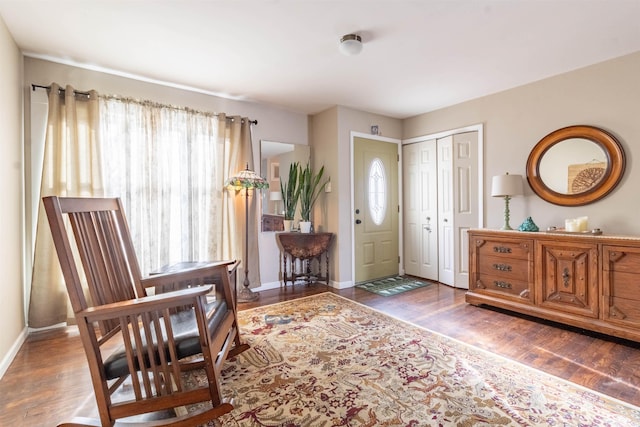 foyer entrance with dark hardwood / wood-style floors