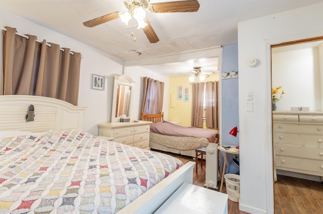 bedroom featuring ceiling fan and wood-type flooring