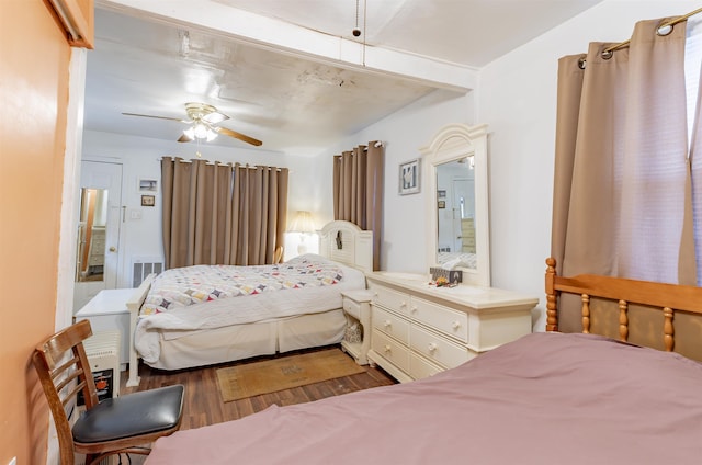 bedroom featuring ceiling fan and dark hardwood / wood-style flooring