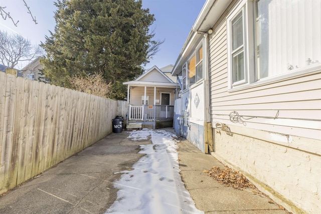 view of property exterior featuring a porch