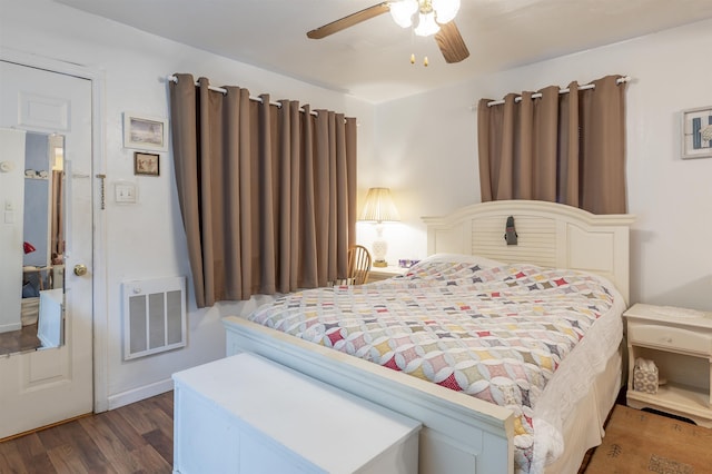 bedroom with ceiling fan and dark hardwood / wood-style flooring