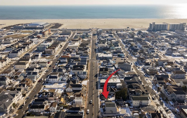 aerial view featuring a water view and a beach view