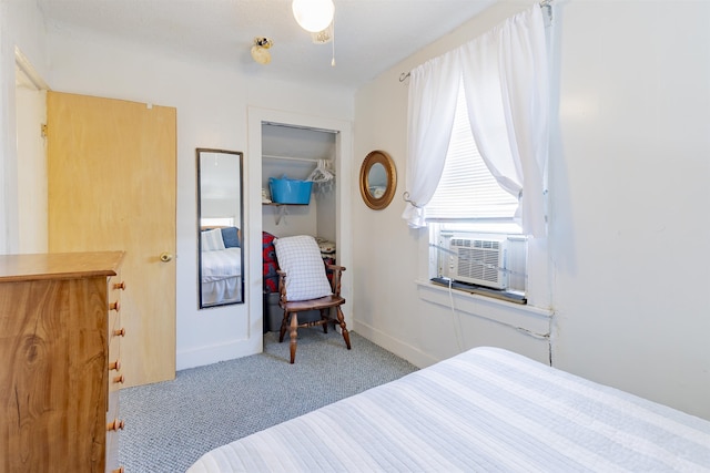 carpeted bedroom featuring a closet and cooling unit