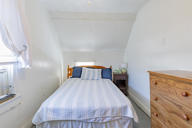 bedroom featuring lofted ceiling