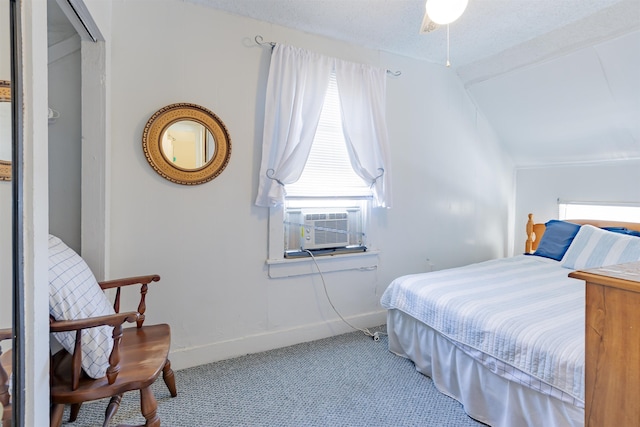 carpeted bedroom featuring cooling unit and vaulted ceiling