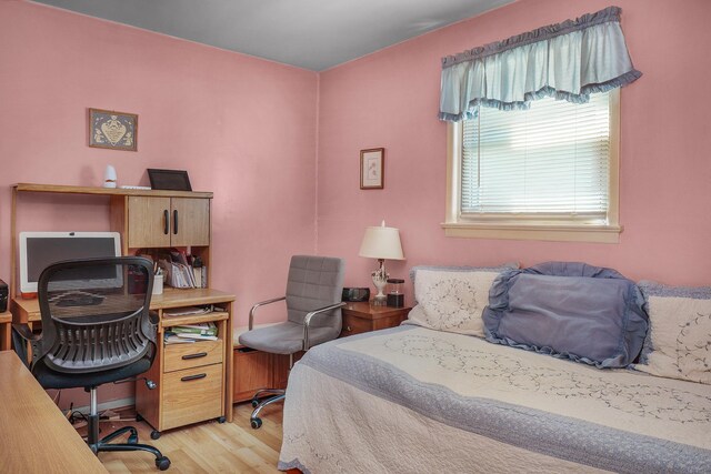 bedroom with light wood-type flooring