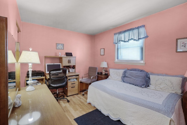 bedroom featuring wood finished floors