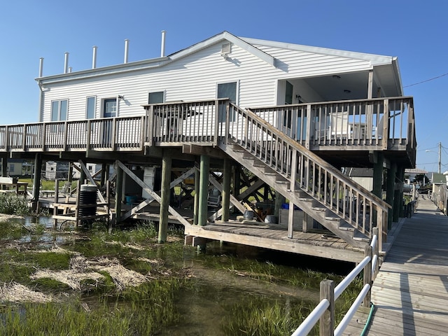 back of house with a wooden deck