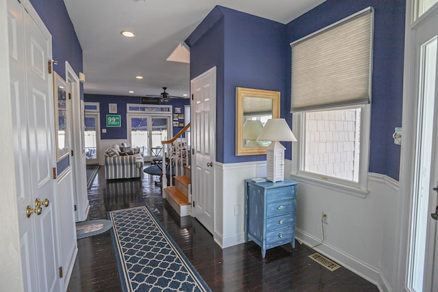 foyer entrance featuring ceiling fan and dark hardwood / wood-style flooring