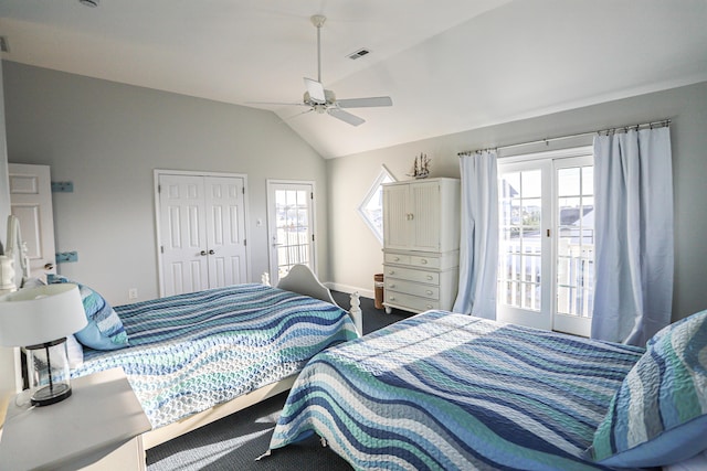 bedroom with carpet, ceiling fan, a closet, and vaulted ceiling