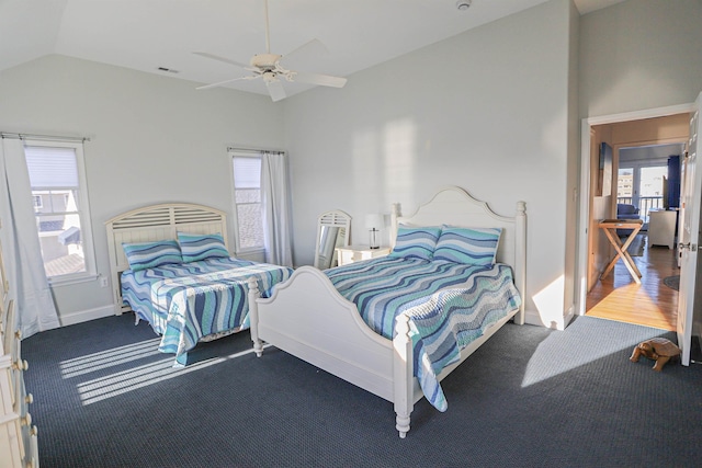 bedroom with carpet, ceiling fan, and vaulted ceiling