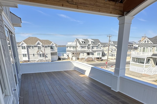 wooden terrace with a residential view