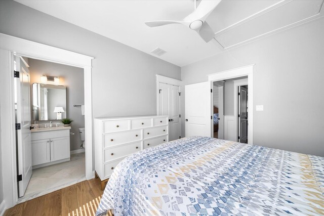 283 85th St, Stone Harbor, NJ 08247 - bedroom featuring attic access, connected bathroom, ceiling fan, and a sink