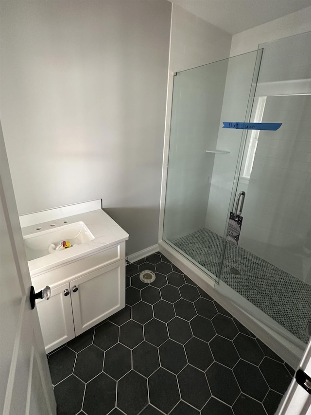 full bathroom with tile patterned floors, vanity, and a shower stall