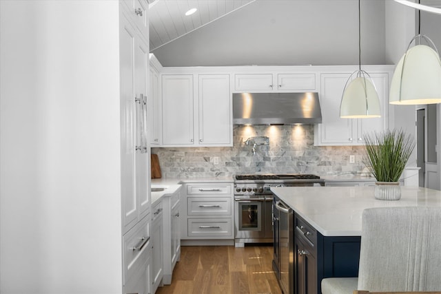 283 85th St, Stone Harbor, NJ 08247 - kitchen featuring under cabinet range hood, wine cooler, range with two ovens, wood finished floors, and white cabinets