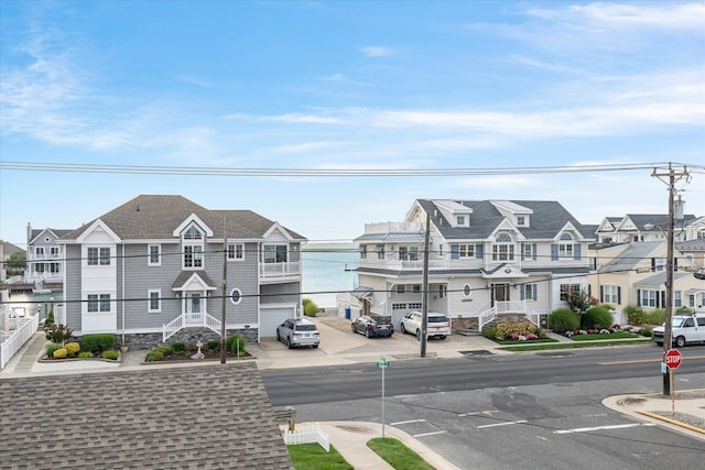 view of street with curbs, sidewalks, and a residential view