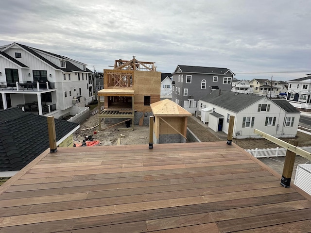 wooden terrace featuring a residential view