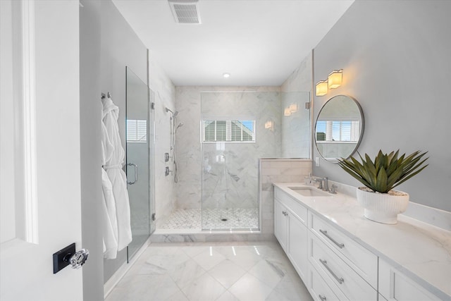 283 85th St, Stone Harbor, NJ 08247 - full bath with plenty of natural light, a marble finish shower, marble look tile flooring, and vanity