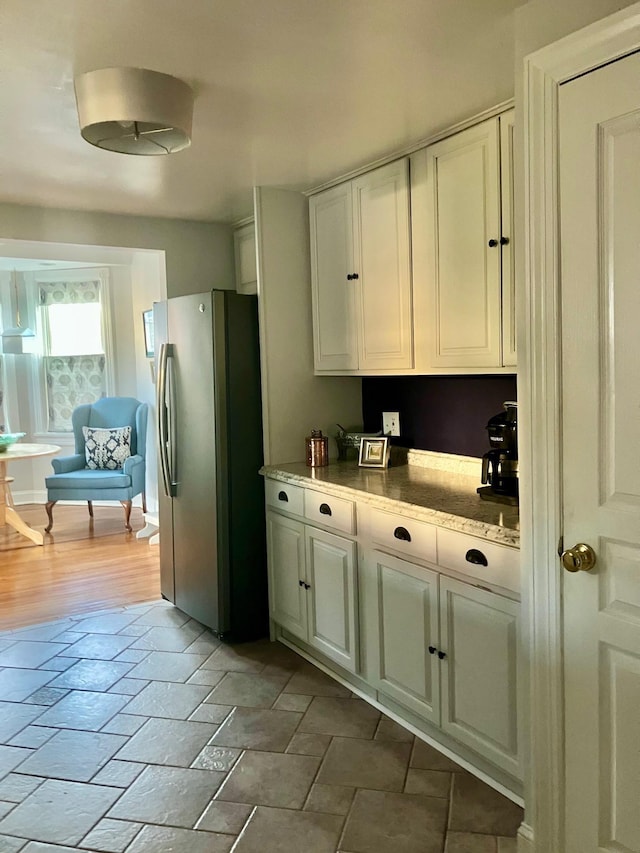 25 Shore Rd, Somers Point, NJ 08244 - kitchen featuring stainless steel fridge and white cabinetry