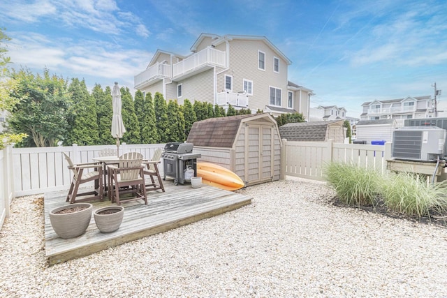 7889 Sunset Dr N, Unit North, Avalon, NJ 08202 - wooden deck with a grill, central AC, outdoor dining area, and a fenced backyard