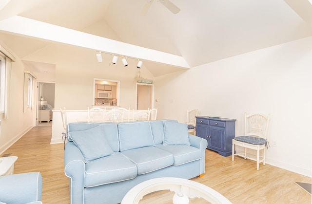 7889 Sunset Dr N, Unit North, Avalon, NJ 08202 - living room featuring lofted ceiling, light wood-style floors, ceiling fan, and baseboards
