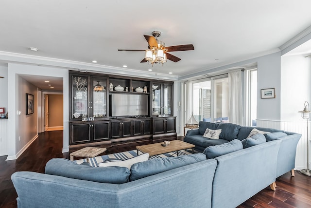 living room with ceiling fan, crown molding, and dark hardwood / wood-style floors