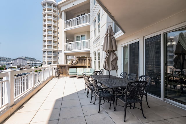 view of patio / terrace featuring an outdoor hangout area and a balcony