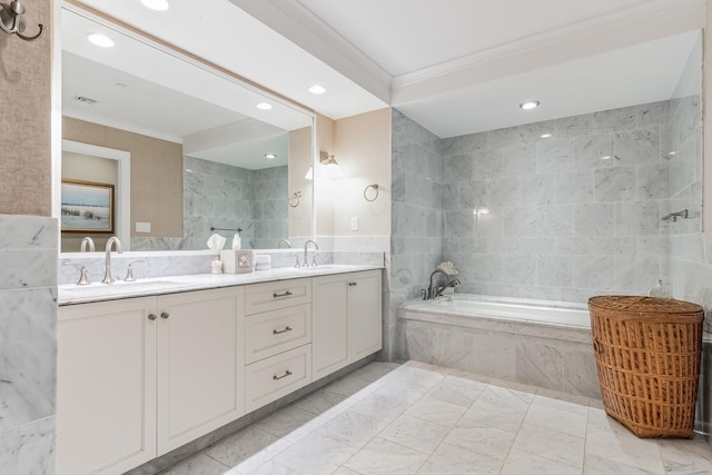 bathroom with tile walls, ornamental molding, tiled tub, and vanity