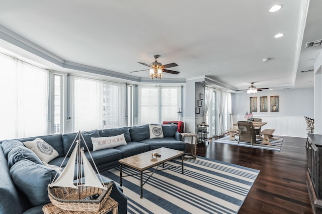 living room with ceiling fan, crown molding, and dark hardwood / wood-style floors