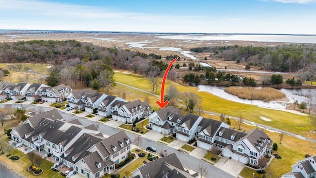 drone / aerial view featuring a water view and a residential view