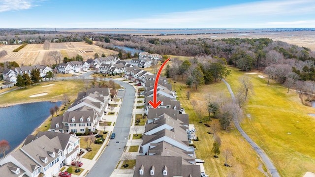 bird's eye view featuring a water view and a residential view