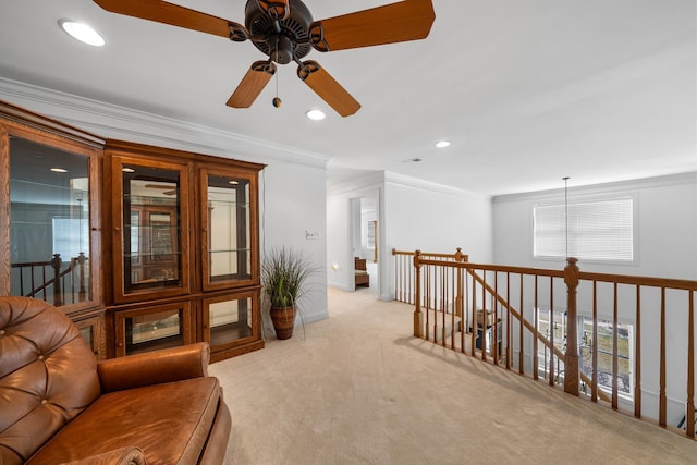 living area featuring recessed lighting, carpet flooring, crown molding, and an upstairs landing