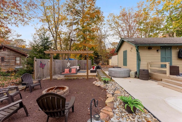 view of patio featuring a pergola, a deck, and an outdoor fire pit