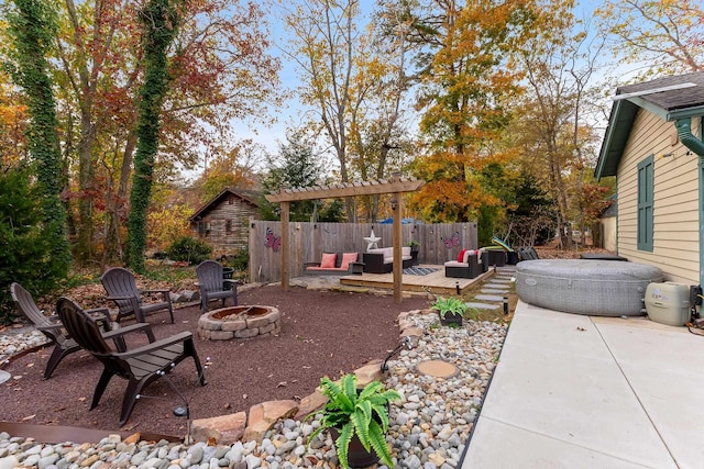 view of patio with an outdoor living space with a fire pit and a wooden deck