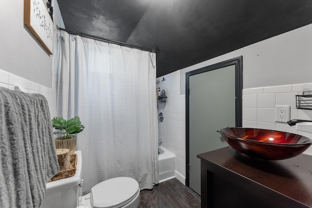 full bathroom featuring vanity, toilet, shower / bath combo with shower curtain, tile walls, and wood-type flooring