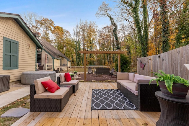 wooden terrace with an outdoor living space