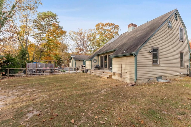 view of side of property with a yard