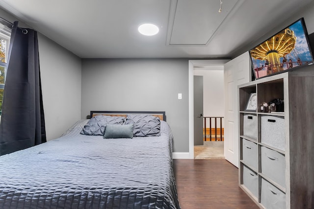 bedroom with dark wood-type flooring